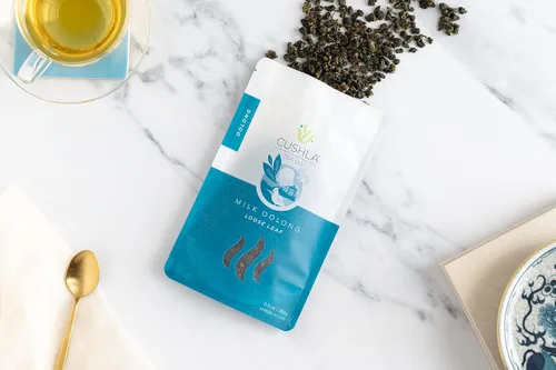 Vista 2 de Té Oolong de leche de alta montaña taiwanesa - Té Oolong con leche Xin Qing - Té de leche de hojas sueltas Jinxuan Oolong