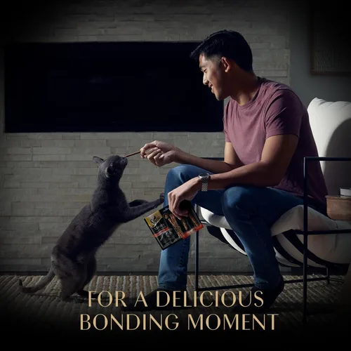 Vista 8 de Sheba Palitos Tiernos de Carne Premios para Gatos con Sabor a Pollo, 0.14 oz., 5 Unidades, Paquete de 10 (50 Palitos en Total)