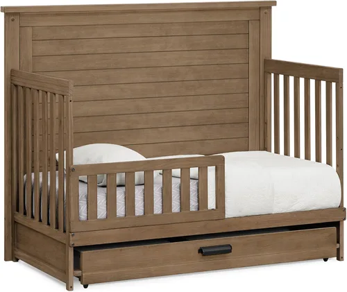 Vista 4 de Delta Children Simmons Kids Caden cuna convertible 6 en 1 con cajón de gaveta, certificada Greenguard Gold, roble envejecido