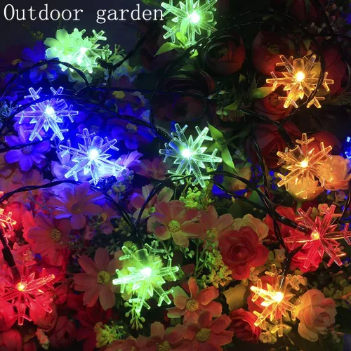 Vista 4 de Anfunman Guirnalda de luces solares de copo de nieve de Navidad, 50 luces LED de 30 pies, impermeables, luces de hadas solares de Navidad, 8 modos