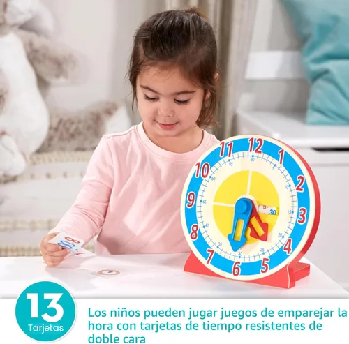 Vista 2 de Reloj de madera educativo para niños, con tarjetas reversibles de hora; juguete "Turn & Tell" de Melissa & Doug