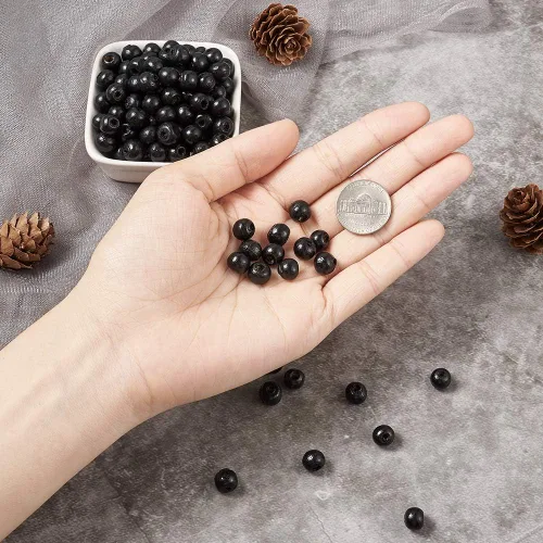 Vista 6 de Craftdady 300 cuentas espaciadoras de bolas de madera de color negro de 0.315 in de madera natural sueltas redondas con agujero de 0.118 in