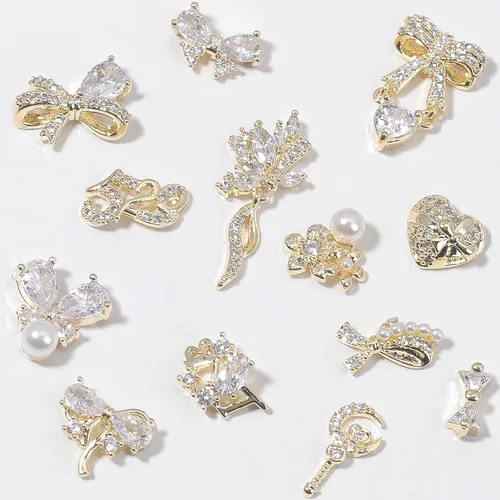 Vista 3 de HNUIX Dijes y gemas para uñas, circonita de cobre dorado, múltiples formas 3D, diamantes de imitación de metal de lujo para uñas, 14 piezas