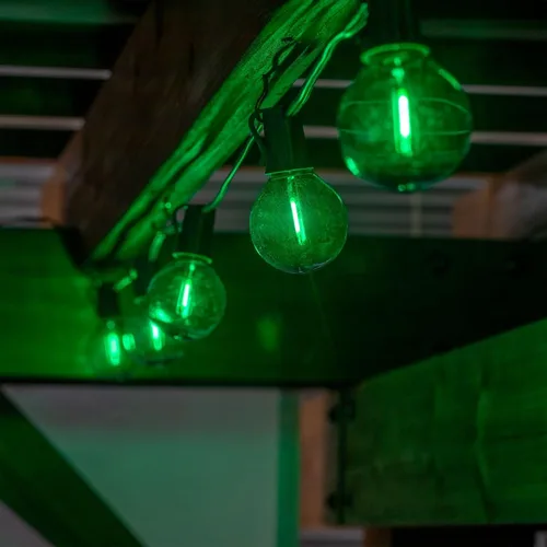 Vista 4 de Novelty Lights Paquete de 25 bombillas LED de filamento verde G50, base intermedia E17/C9, equivalente a 7 vatios, bombillas de repuesto